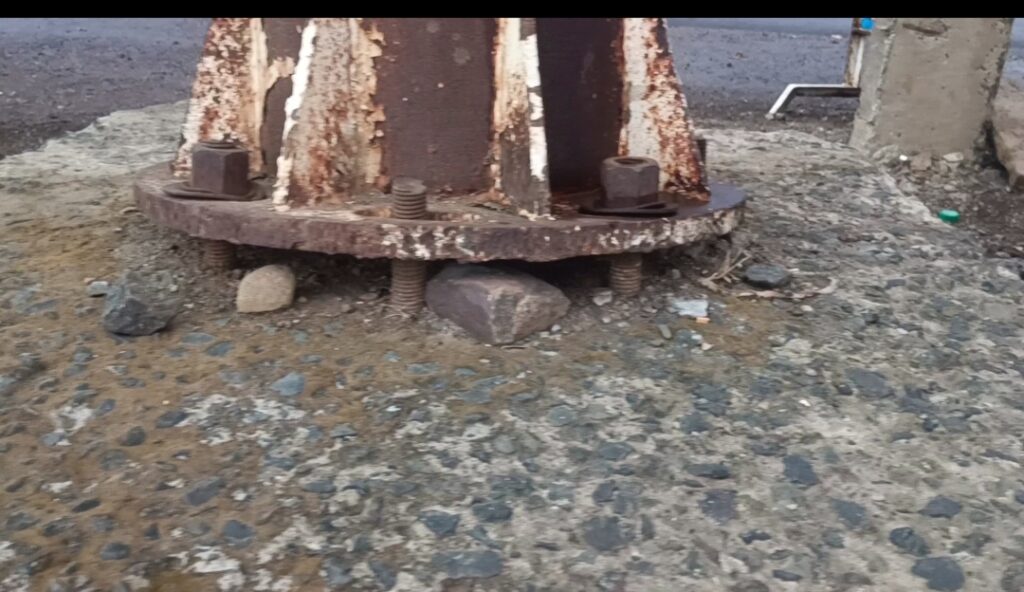 Badwah Katkut main road par 15 degree jhuka MP Tourism Sailani Island direction sign board with damaged base bolts